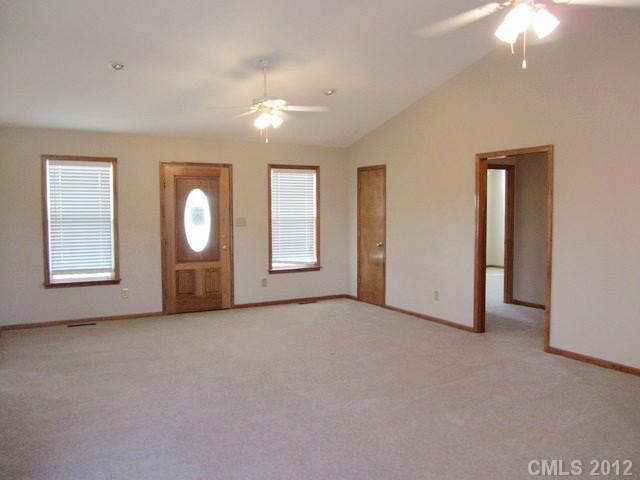 476 Owens Road York, SC 29745 - Photo 5 of 12 an empty room with windows and mirror