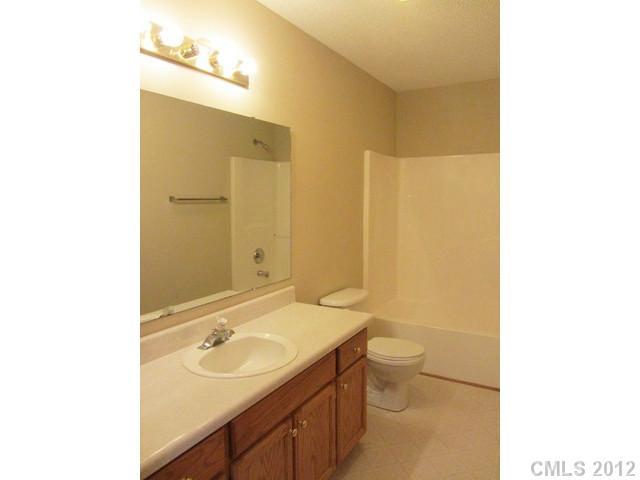 476 Owens Road York, SC 29745 - Photo 6 of 12 a bathroom with a sink a toilet and a mirror