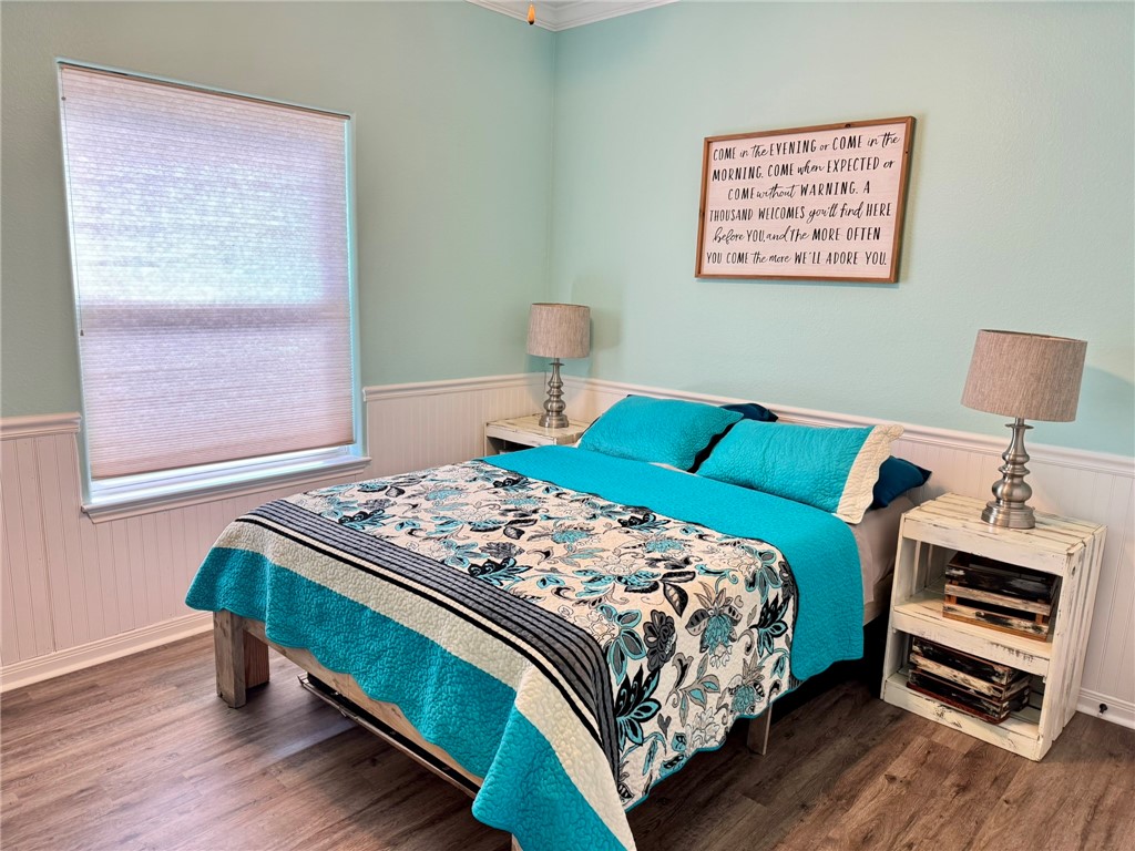 2106 Halcon Street Corpus Christi, TX 78414 - Photo 14 of 23 a bedroom with a bed and a window