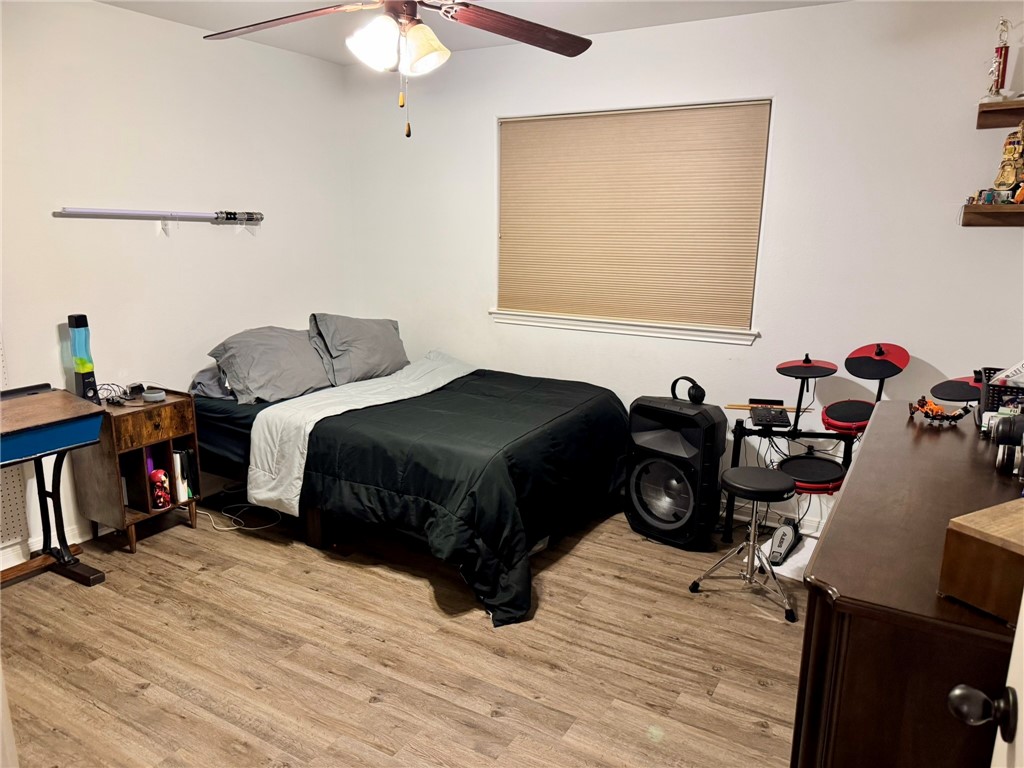 2106 Halcon Street Corpus Christi, TX 78414 - Photo 15 of 23 a bedroom with a bed a window and dresser