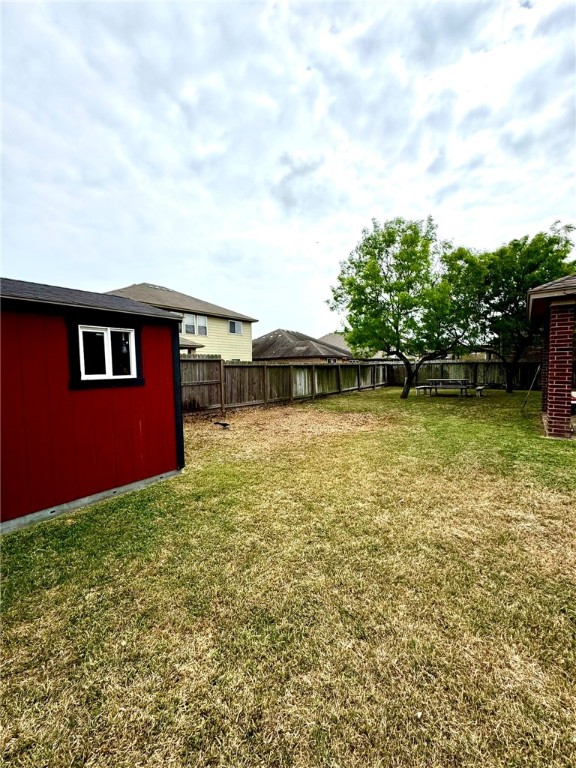 2106 Halcon Street Corpus Christi, TX 78414 - Photo 22 of 23 a view of a house with swimming pool and a yard