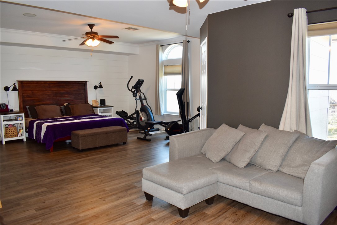 2106 Halcon Street Corpus Christi, TX 78414 - Photo 8 of 23 a bedroom with bed couch and window