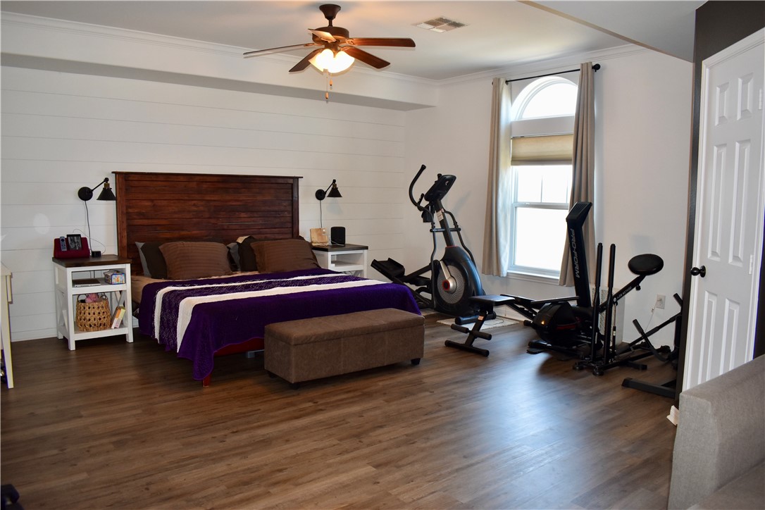 2106 Halcon Street Corpus Christi, TX 78414 - Photo 9 of 23 a bedroom with bed window and a mirror