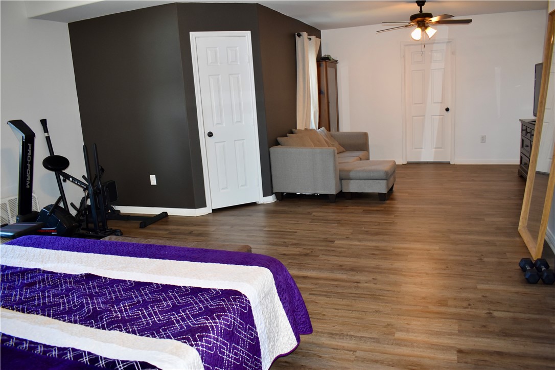 2106 Halcon Street Corpus Christi, TX 78414 - Photo 10 of 23 a bedroom with a bed and wooden floor