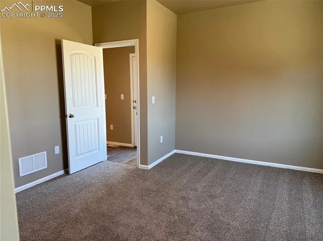 an empty room with a door