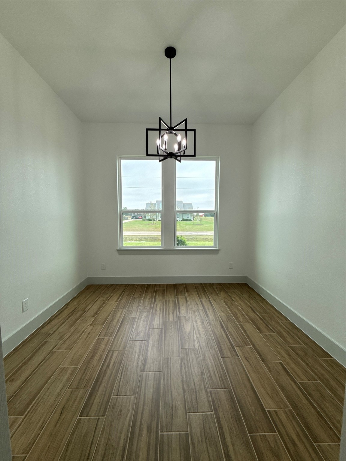 931 Buffalo Trail Angleton, TX 77515 - Photo 9 of 20 a view of a room with wooden floor chandelier and window
