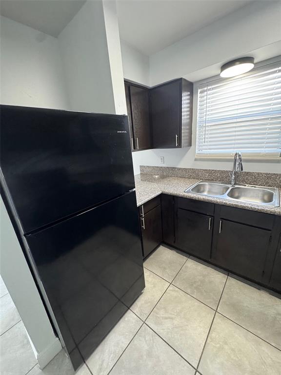 1195 Bentley Road, Unit 1 Leesburg, FL 34748 - Photo 7 of 13 a kitchen with a sink and a mirror