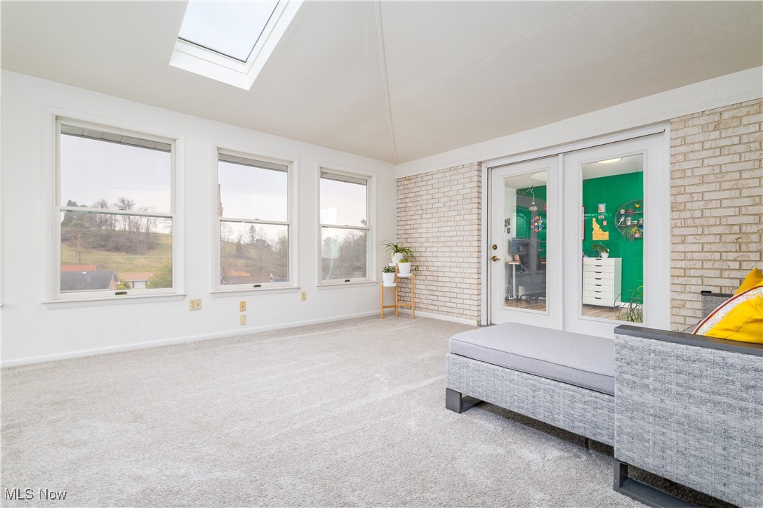 137 Preston Road Steubenville, OH 43953 - Photo 26 of 38 Sunroom / solarium with french doors, a skylight, and plenty of natural light