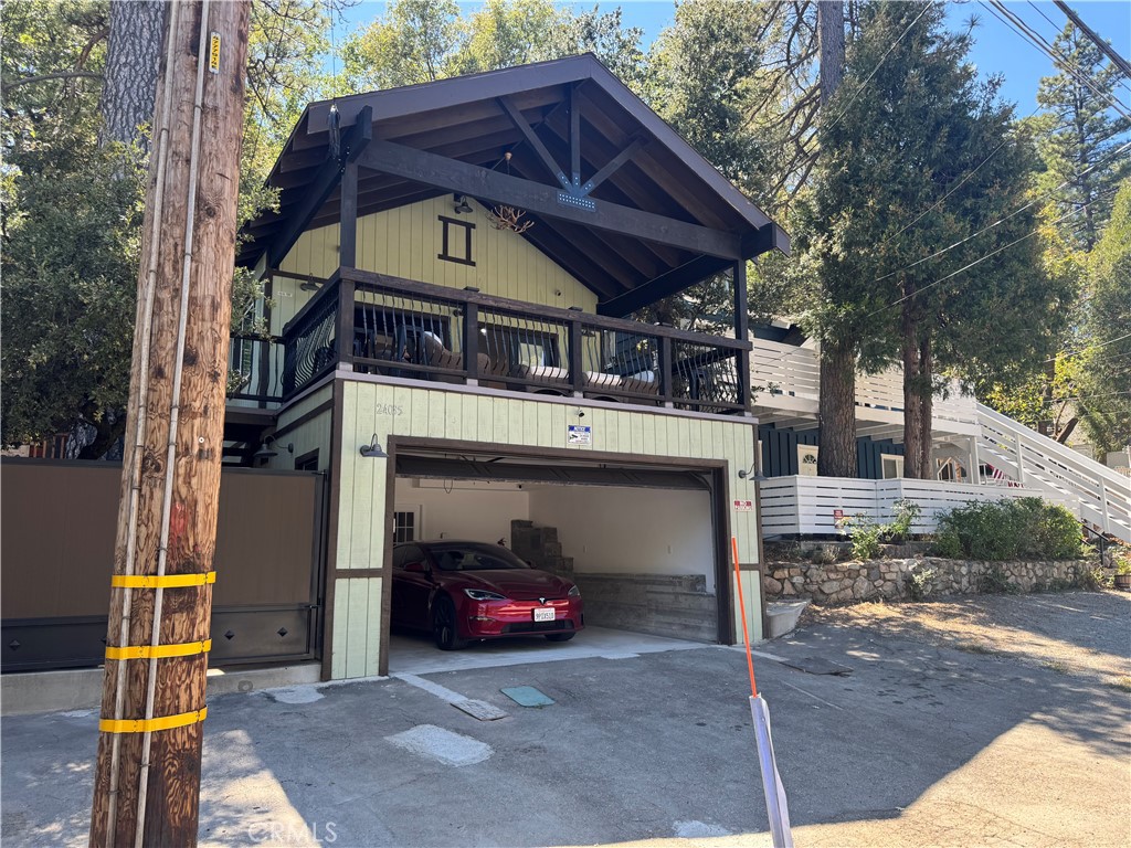 24035 Pioneer Camp Road Crestline, CA 92325 - Photo 1 of 6 a view of a car park in front of house