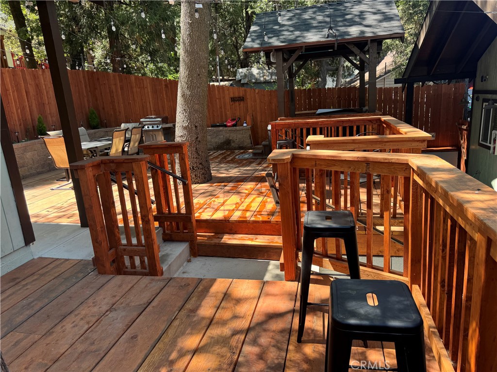24035 Pioneer Camp Road Crestline, CA 92325 - Photo 5 of 6 a view of balcony with outdoor seating