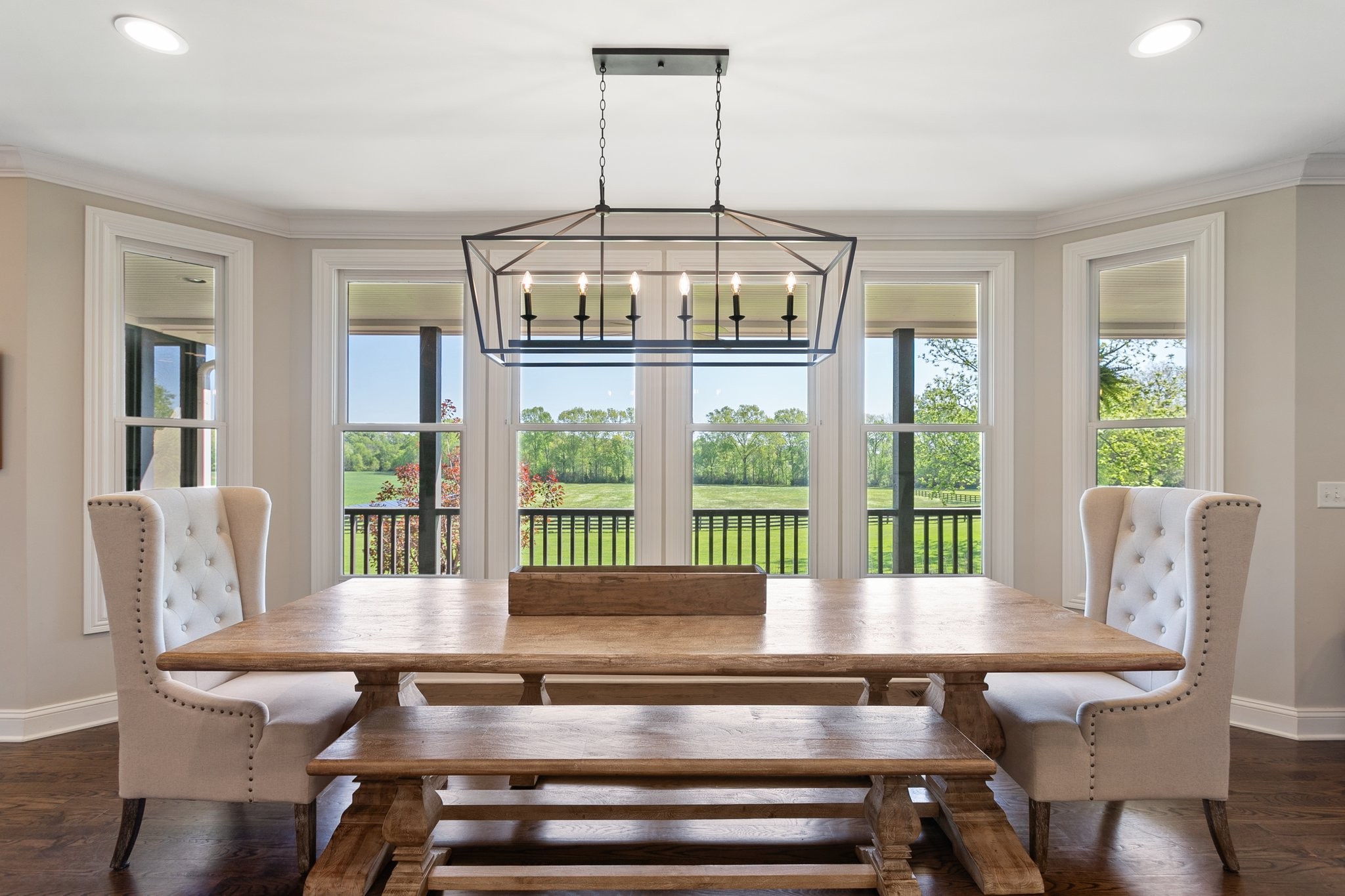 4360 Arno Road Franklin, TN 37064 - Photo 5 of 24 a dining room with furniture a chandelier and wooden floor