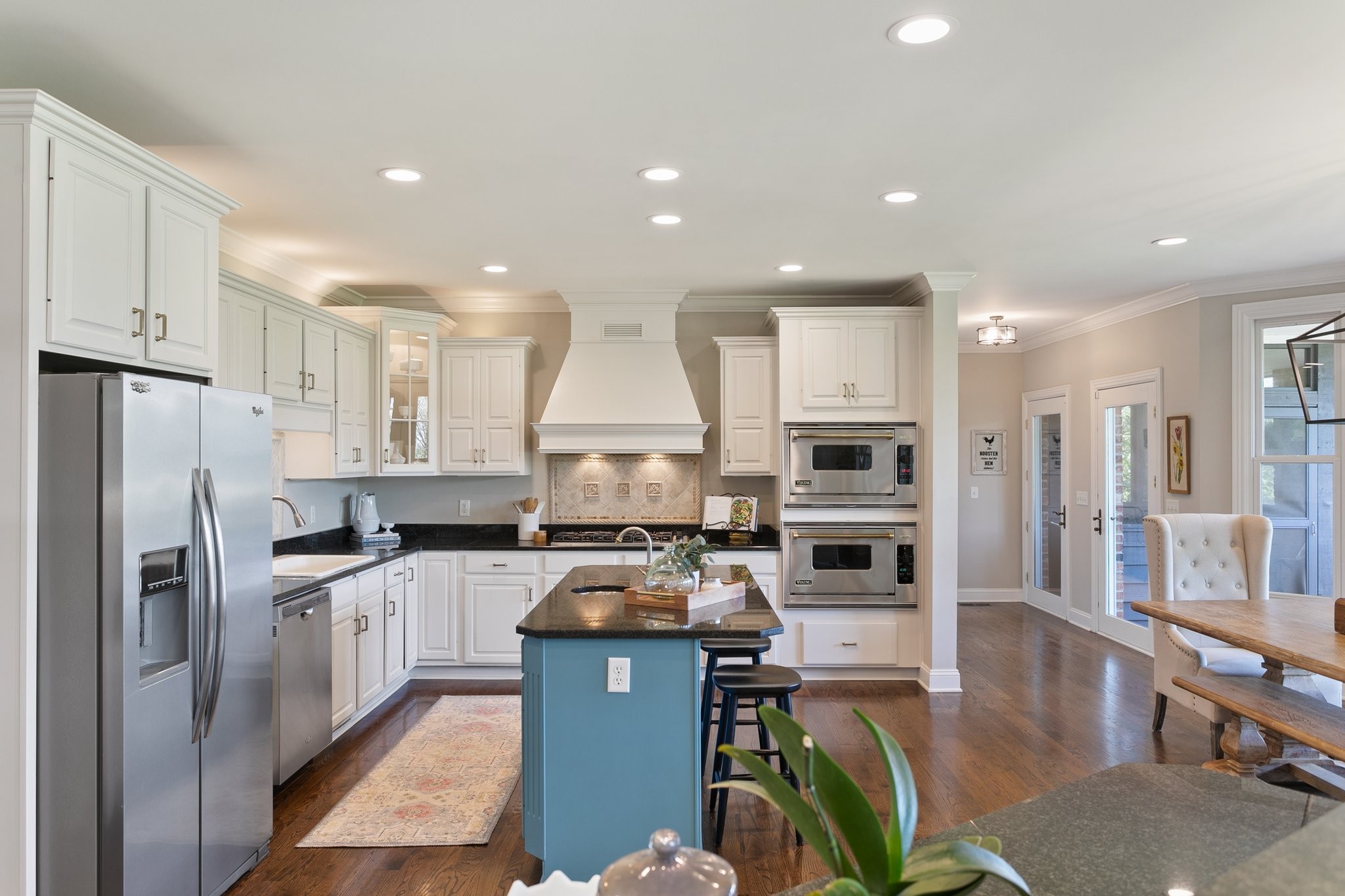 4360 Arno Road Franklin, TN 37064 - Photo 6 of 24 a kitchen with stainless steel appliances a stove a sink a microwave a refrigerator and cabinets
