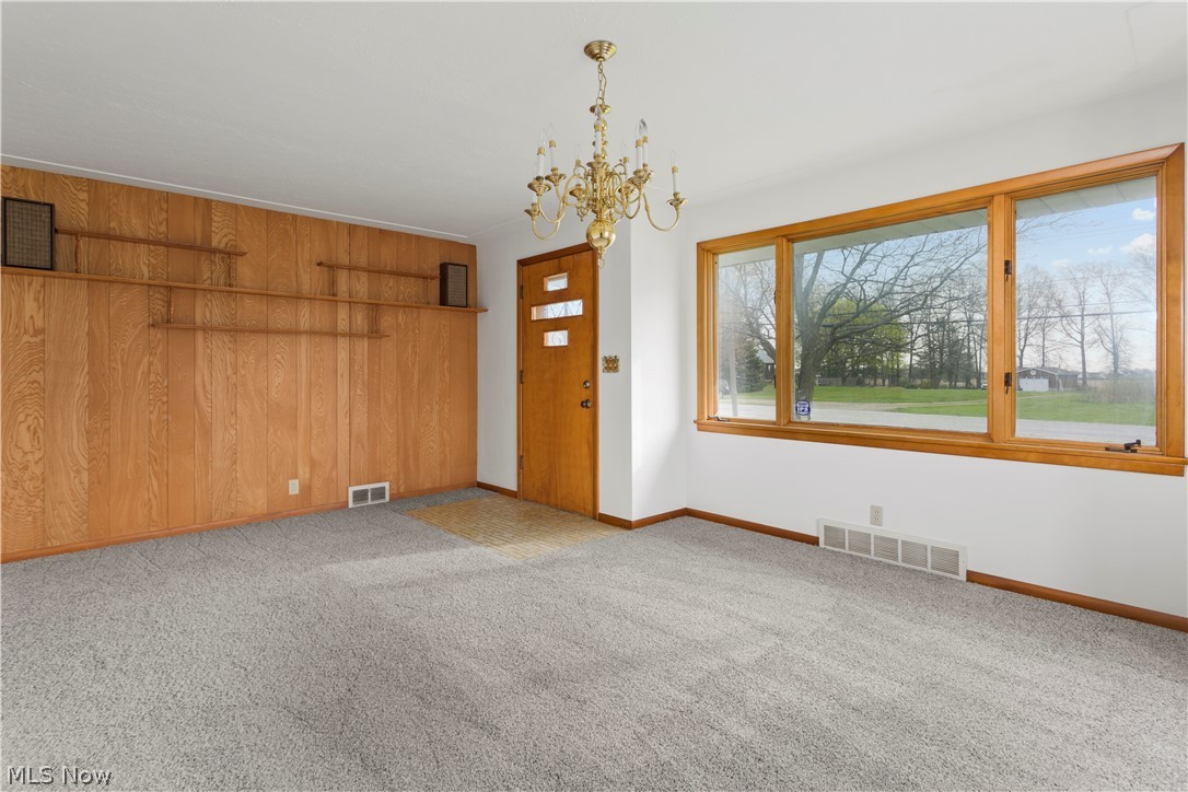 8514 West Ridge Road Elyria, OH 44035 - Photo 17 of 33 Dining Room with feature wall and large windows