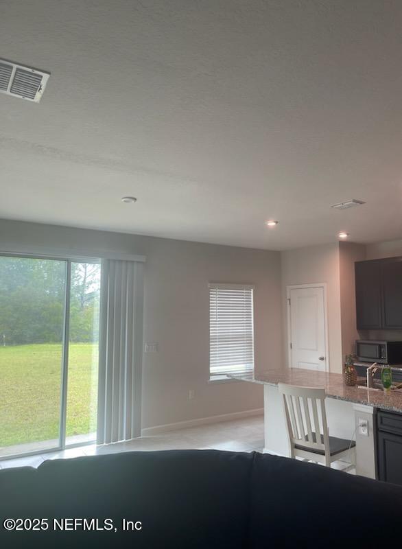 1094 Victoria Hills Jacksonville, FL 32221 - Photo 4 of 15 a view of an empty room with a window