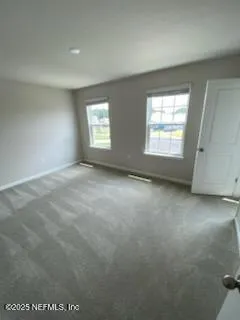 a living room with furniture window and a window