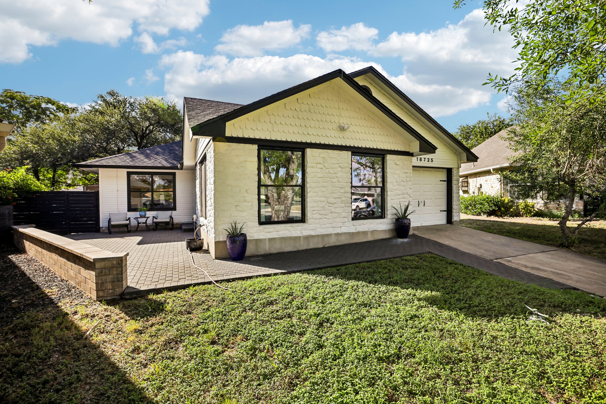 16725 Whitebrush Loop Austin, TX 78717 - Photo 27 of 32 Cul de sac lot with lots of privacy, presents a welcoming front exterior with a paved patio and an attached garage.