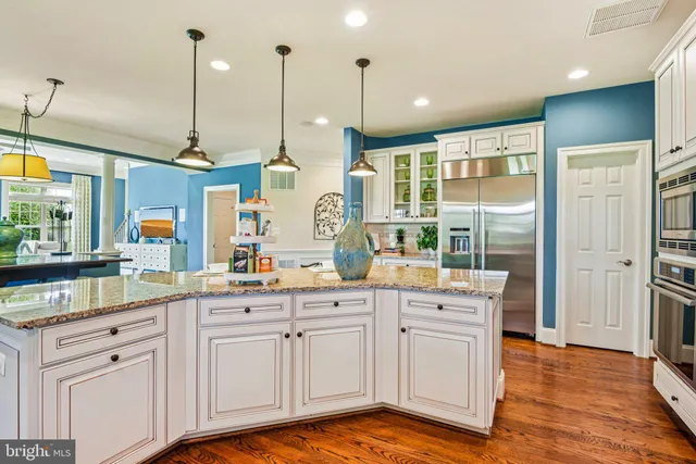 a living room with furniture a flat screen tv and a large window