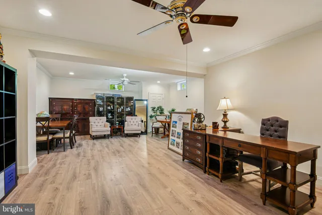 a living room with furniture and a dining table