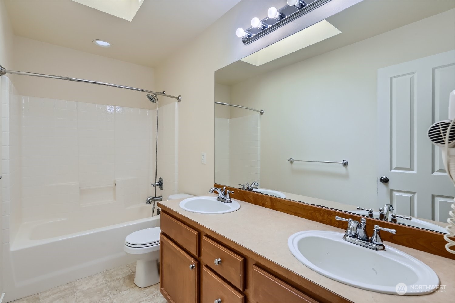 3604 184th Place Southeast Bothell, WA 98012 - Photo 34 of 39 a bathroom with a sink a toilet a mirror and shower