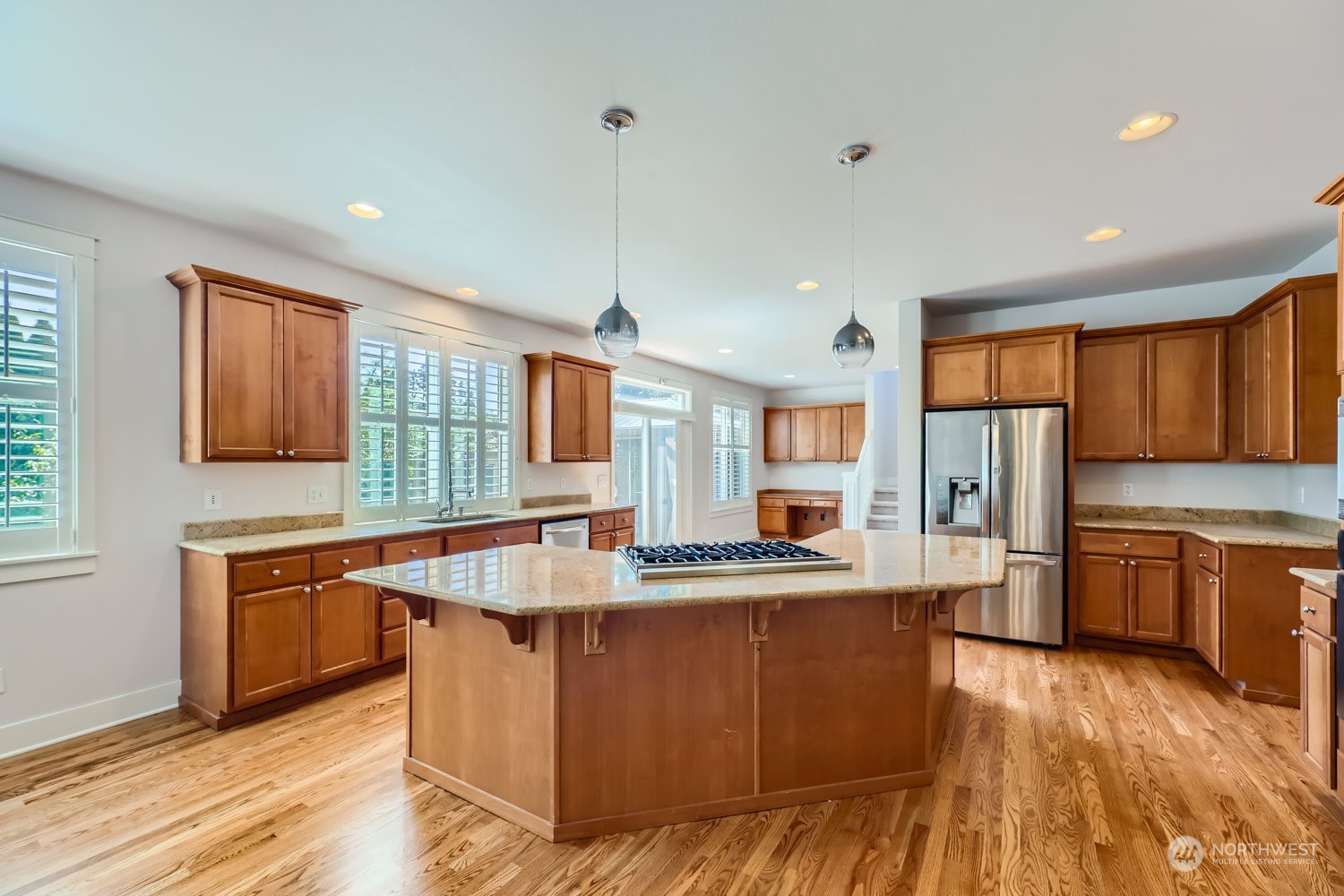 3604 184th Place Southeast Bothell, WA 98012 - Photo 8 of 39 a kitchen with stainless steel appliances granite countertop a sink a stove and refrigerator