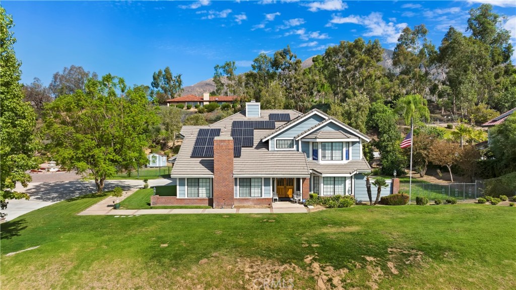 28558 Oak Ridge Road Highland, CA 92346 - Photo 1 of 1 a view of a house with a big yard and large trees