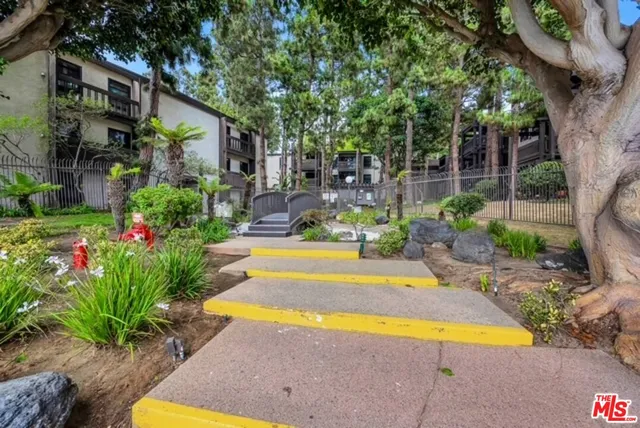 a view of swimming pool with sitting area and garden