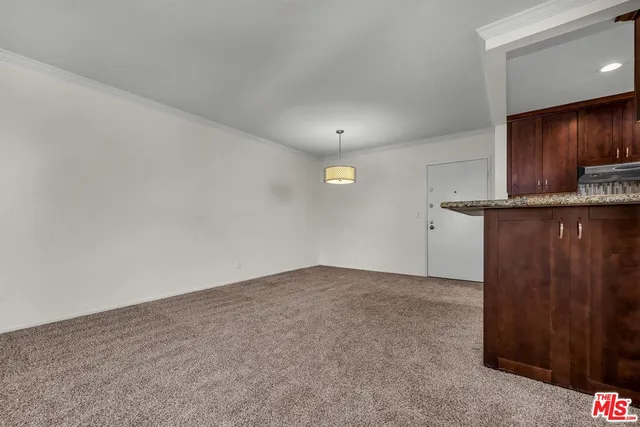 a view of a kitchen with a sink
