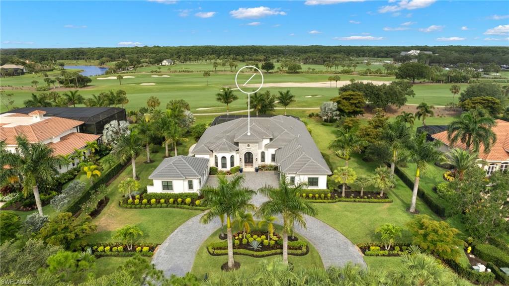 11681 Bald Eagle Way Naples, FL 34120 - Photo 1 of 50 an aerial view of a house with a yard and lake view