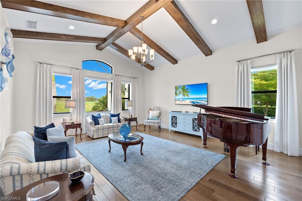 11681 Bald Eagle Way Naples, FL 34120 - Photo 13 of 50 a living room with furniture a rug and a large window