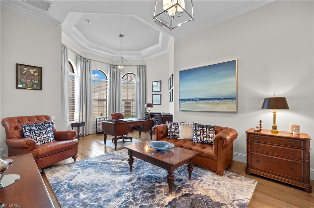 11681 Bald Eagle Way Naples, FL 34120 - Photo 15 of 50 a living room with furniture and a wooden floor