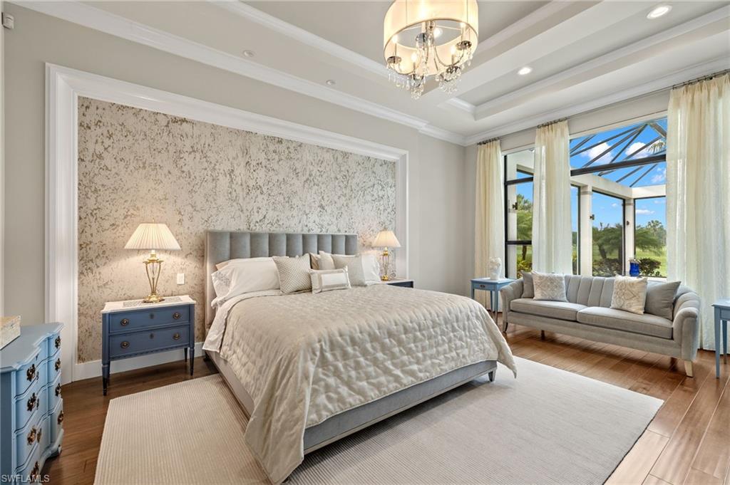 11681 Bald Eagle Way Naples, FL 34120 - Photo 16 of 50 a bedroom with a large bed and a couch