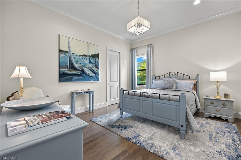 11681 Bald Eagle Way Naples, FL 34120 - Photo 23 of 50 a bedroom with a bed and window