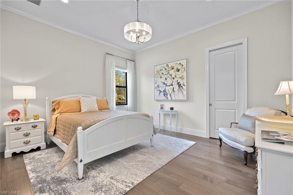 11681 Bald Eagle Way Naples, FL 34120 - Photo 25 of 50 a spacious bedroom with a bed and a window