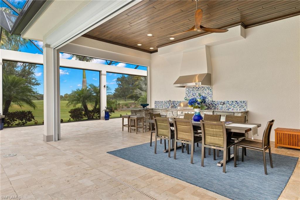 11681 Bald Eagle Way Naples, FL 34120 - Photo 40 of 50 a outdoor space with furniture lots of tables and chairs