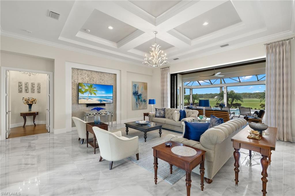 11681 Bald Eagle Way Naples, FL 34120 - Photo 4 of 50 a living room with furniture and a large window