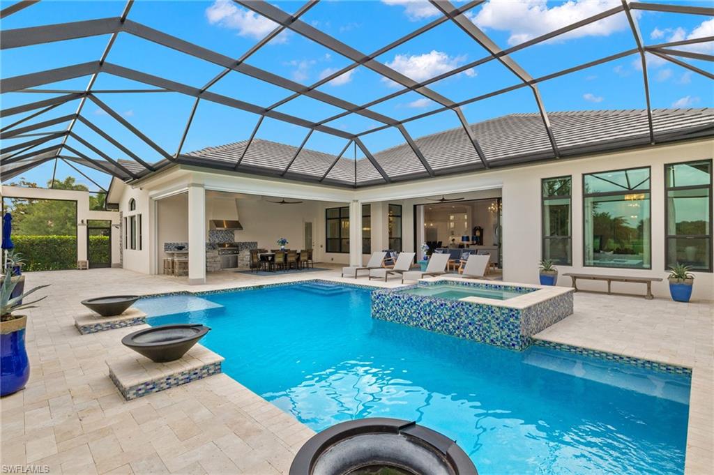 11681 Bald Eagle Way Naples, FL 34120 - Photo 43 of 50 a view of swimming pool with outdoor seating