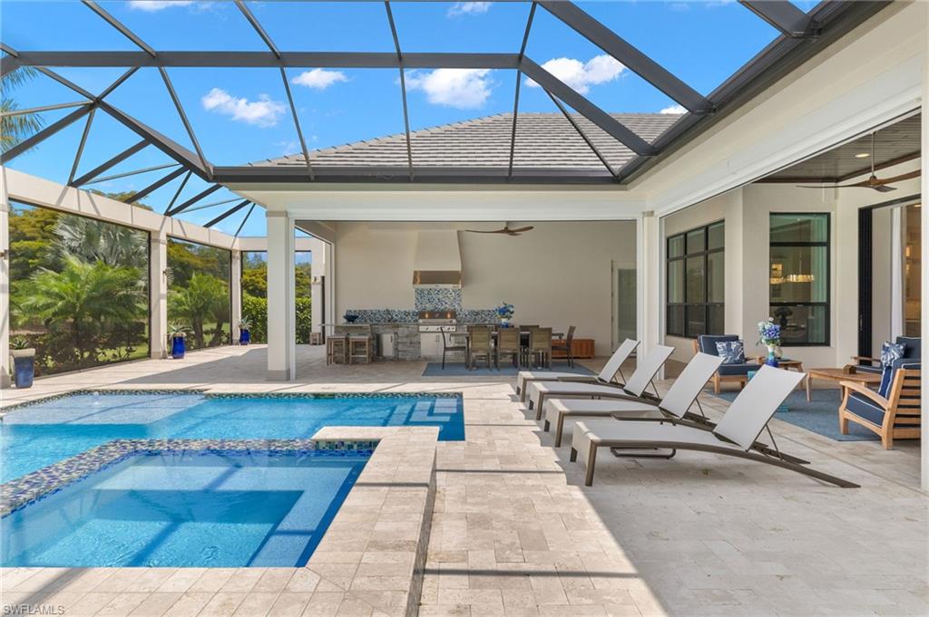 11681 Bald Eagle Way Naples, FL 34120 - Photo 44 of 50 a living room with lots of furniture and a large window