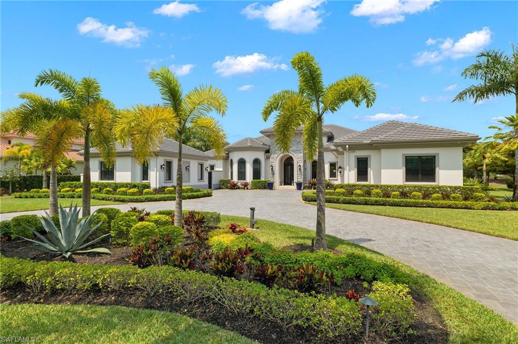 11681 Bald Eagle Way Naples, FL 34120 - Photo 47 of 50 a front view of a house with a garden