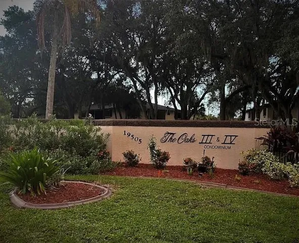 a view of house with outdoor seating