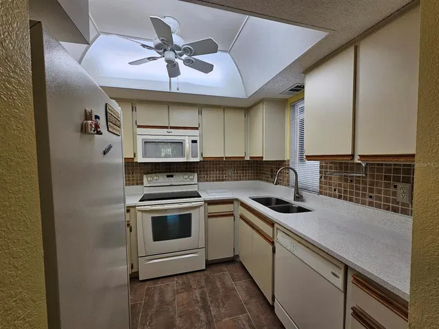 a kitchen with a stove and a sink