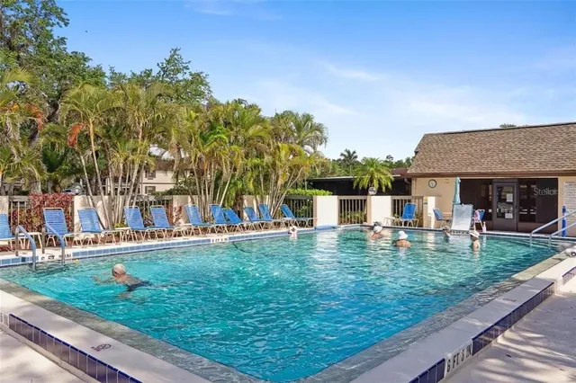 a view of a park with large trees