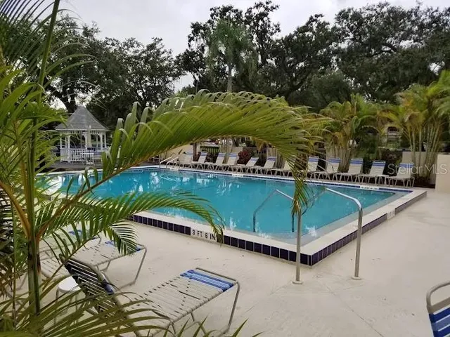a view of outdoor space with garden and trees