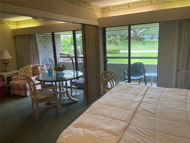 a view of a dining room with furniture window and outside view