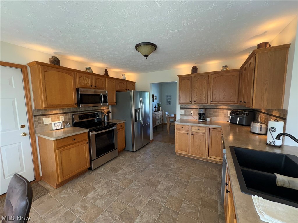203 River's Edge Drive Amherst, OH 44001 - Photo 14 of 33 kitchen cabinets have lighting