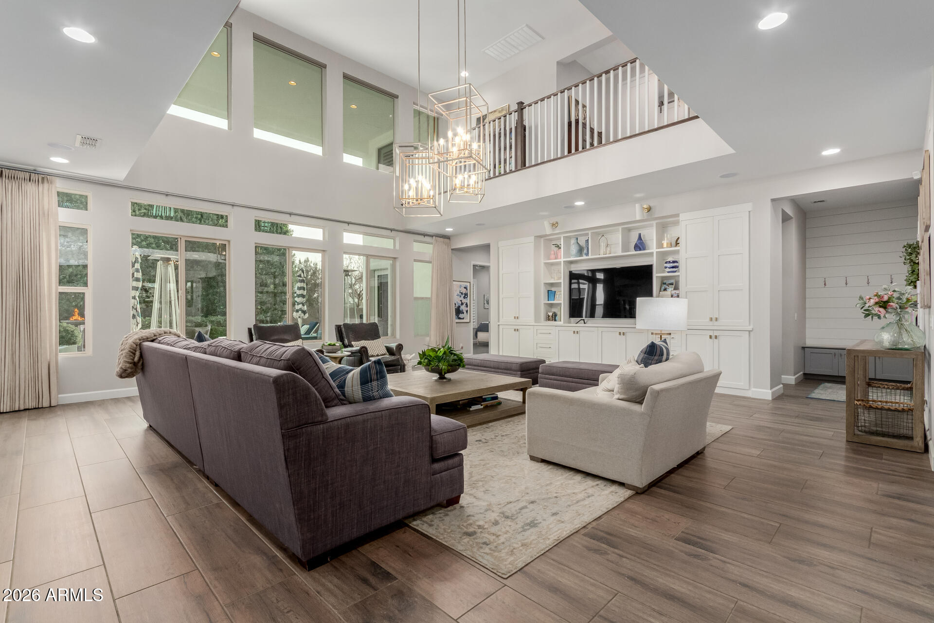 2917 East Boot Track Trail Gilbert, AZ 85296 - Photo 19 of 93 a living room with furniture kitchen view and a large window