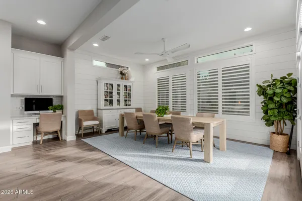 a room with gym equipment and windows