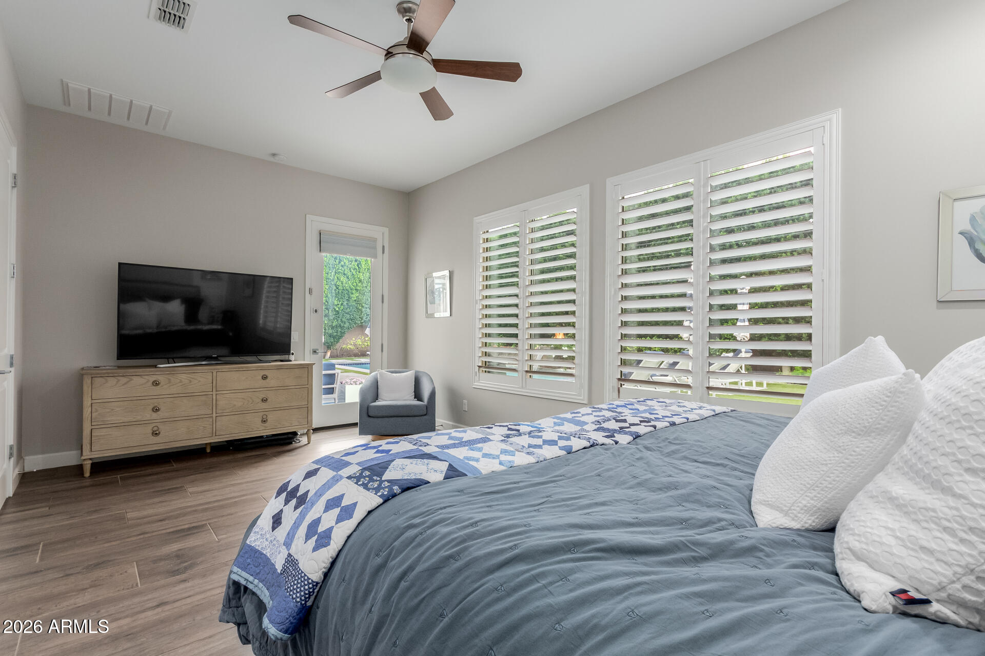 2917 East Boot Track Trail Gilbert, AZ 85296 - Photo 31 of 93 a bedroom with a bed and a flat screen tv