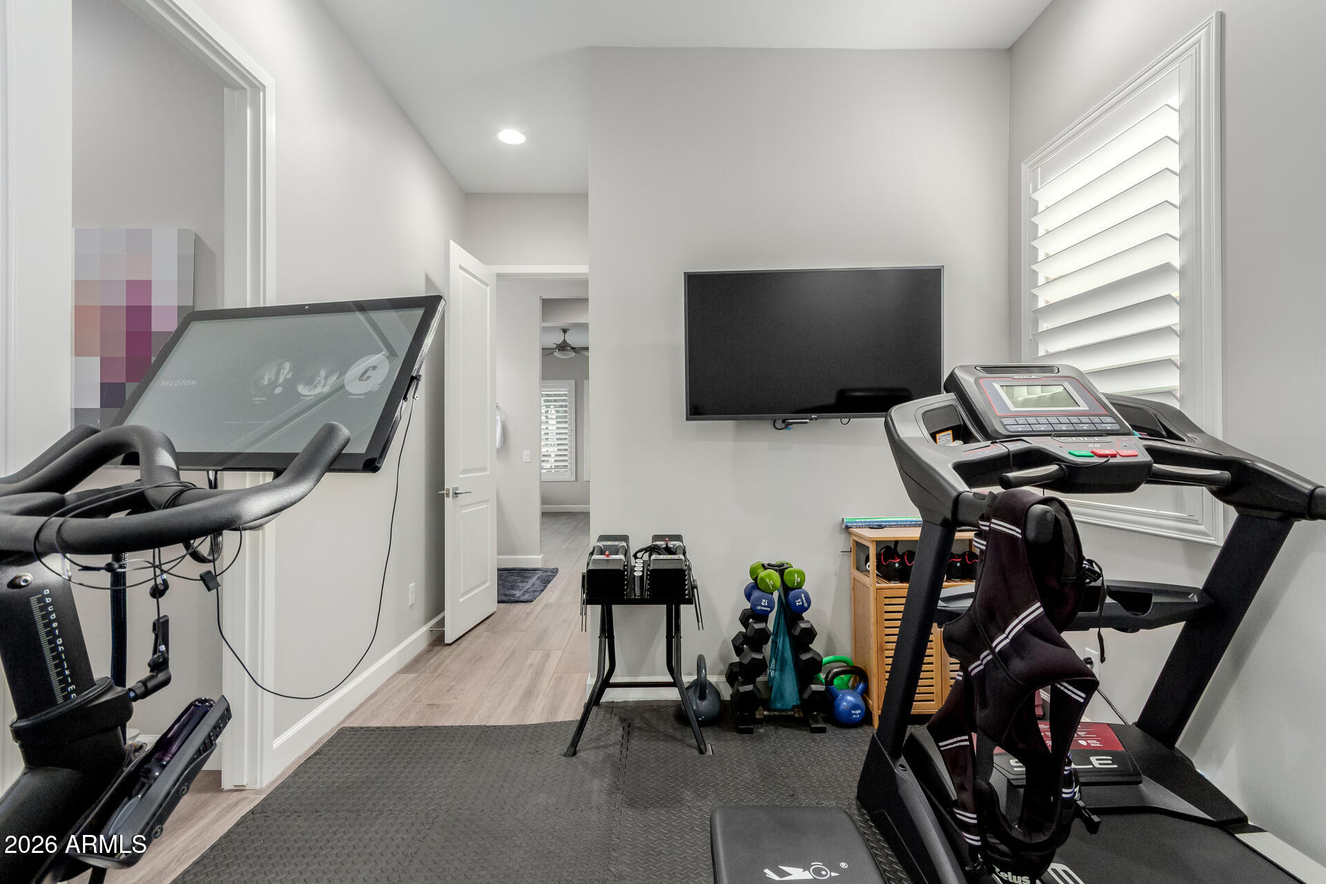 2917 East Boot Track Trail Gilbert, AZ 85296 - Photo 35 of 93 a room with gym equipment and windows
