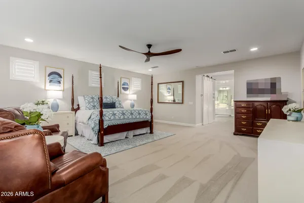 a view of a house with swimming pool and sitting area