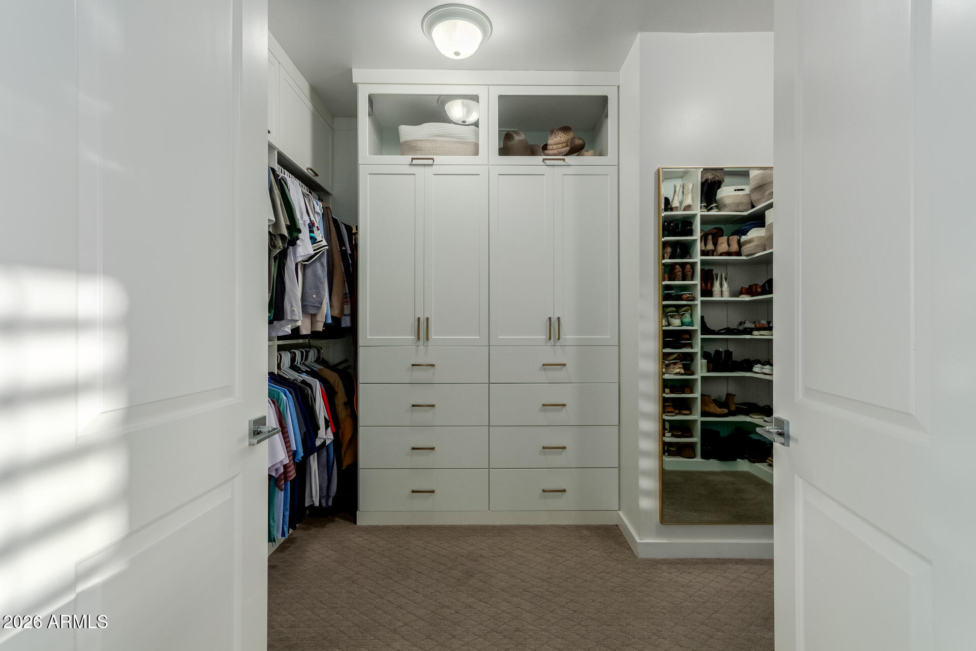 2917 East Boot Track Trail Gilbert, AZ 85296 - Photo 51 of 93 a view of walk in closet with clothes and shoes